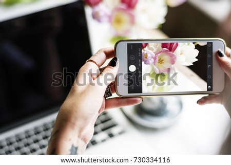 Woman Hands Using Mobile Phone Capture Photo with Laptop Background
