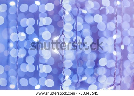 Soft  pink colorful bokeh background. Luminous garlands of electric lights. Copy space to add text. Saturated colors. Blurry abstraction. Gentle tone.  