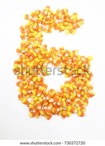 Halloween candy corns on white background