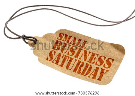 Small Business Saturday sign - a paper price tag with a twine isolated on white Royalty-Free Stock Photo #730376296