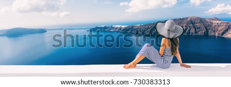 Travel luxury cruise vacation holiday woman panoramic banner. Sun hat maxi dress woman relaxing at sea view in Santorini, Oia, Greece. Europe destination.