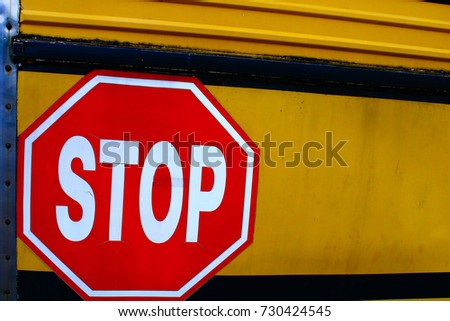 Stop sign with the yellow background.