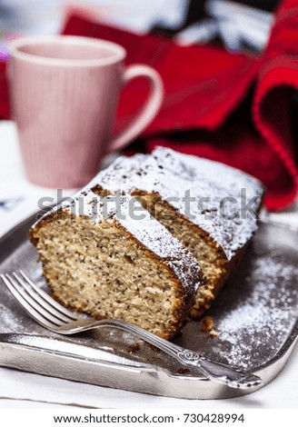 Tea chia seeds cake (keks) on a silver plate	
