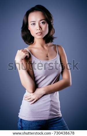 Portrait of a pretty asian woman in casual clothes. Asian beauty. Studio shot.