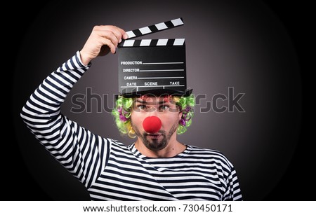 Funny clown with clipper box. 