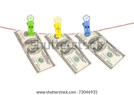 One hundred dollars bill hanging on a clothesline isolated on white background