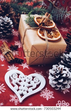 Christmas background with a gift box and christmas decorations in vintage style. Christmas present. New Year 2018. Christmas gifts box presents on brown paper