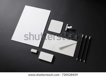 Photo of blank corporate identity template. Stationery set on black background. Branding mockup for placing your design.