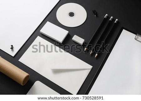 Corporate identity template. Photo of blank stationery on black paper background. Mock up for design portfolios.