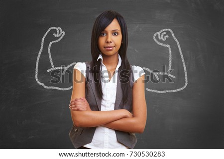 Strong and powerful woman with self confidence and chalk muscles Royalty-Free Stock Photo #730530283