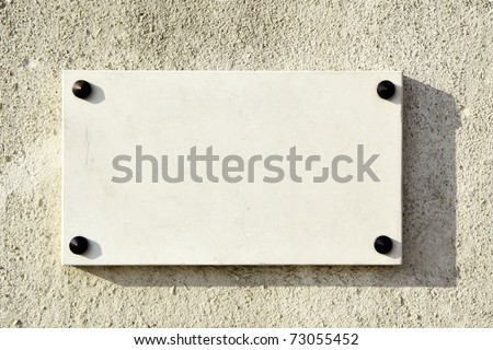 Blank marble signboard close-up over wall