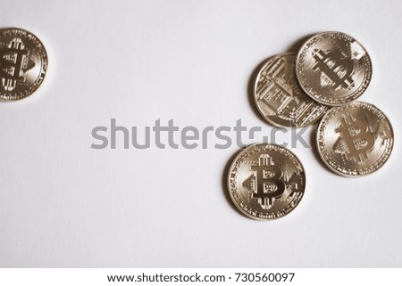 Bitcoins on a white background. A concept from coins of the cryptocurrency.