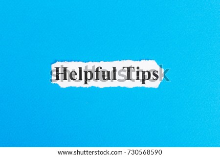 Helpful Tips text on paper. Word Helpful Tips on torn paper. Concept Image.