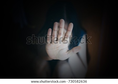 Businessman holding hand up and saying Stop