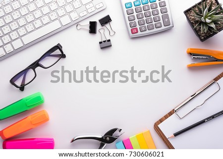 White office desk table with school accessories with office supplies. Top view with copy space