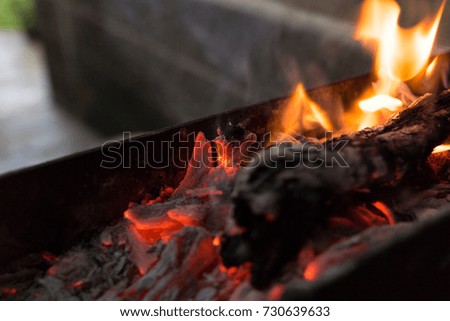 Burning coals on the grill