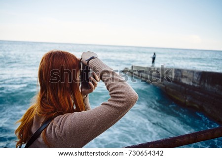 photographer takes pictures of the sea, evening, nature                               