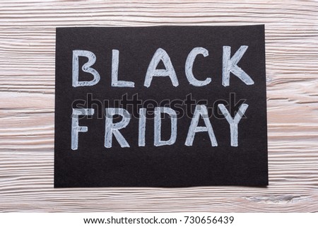 Black Friday tag on wooden background 