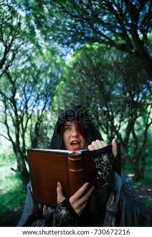 Witch reading spell from book