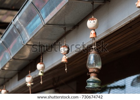 Hanging ceramic dolls to decorate