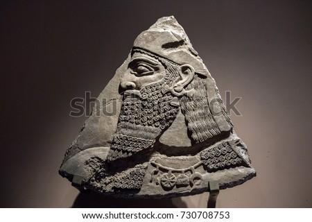 Ancient Babylonia and Assyria bas relief from king Ashurnasirpal Nimrud Palace Royalty-Free Stock Photo #730708753