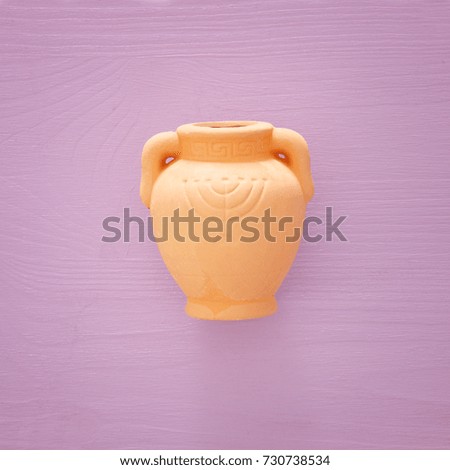 jewish holiday Hanukkah image background with traditional oil ceramic jug.