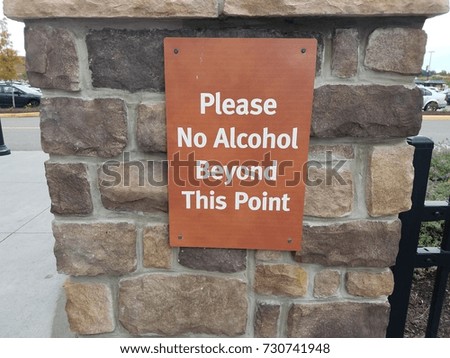 please no alcohol beyond this point sign on rocks