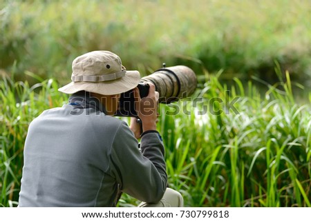 Professional wildlife photographer outdoor