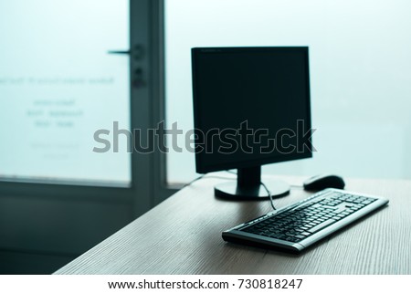 Desktop PC computer in empty office, closing small business and entrepreneurship background