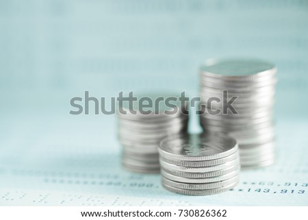 Stacks of coins and account book or credit card with copy space, finance and business finance concept, shallow focus.