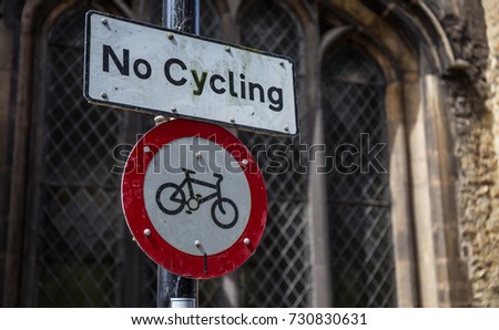 No Cycling Sign with gothic church background