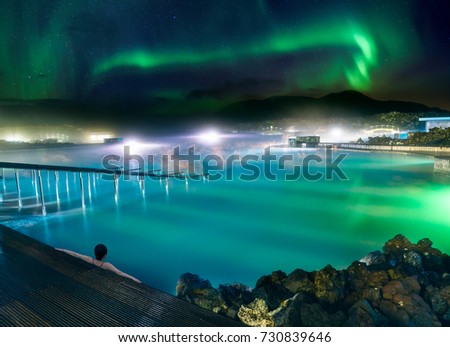 A wonderful vacation at Blue Lagoon in Iceland with Northern Lights. Royalty-Free Stock Photo #730839646