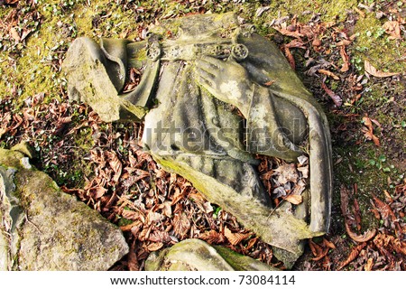 Fragment of ancient Jesus on a old Prague Cemetery
