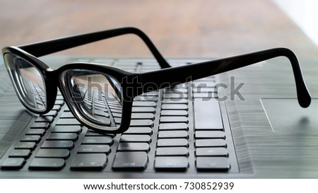   Glasses on the computer keyboard during a break                             