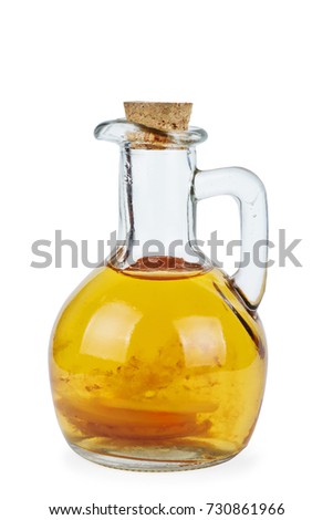 Decanter with old apple vinegar isolated on the white background
