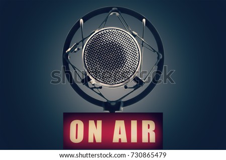 professional microphone and on air sign Royalty-Free Stock Photo #730865479