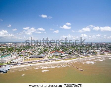 Galveston Island along the seawall from the air   Royalty-Free Stock Photo #730870675