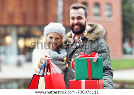 Picture of couple shopping for Christmas in the city