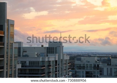 Brilliant Colorful Sunset Over Condo Buildings With Cityscape In The Background In Vaughan Ontario Canada Royalty-Free Stock Photo #730888906
