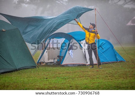 Travelers are repairing tents During the rainy