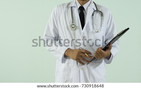 Doctor writing a medical prescription order some treatment for patient in the hospital