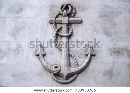 A stone carving of an Anchor located on Lombard street in the City of London, UK.