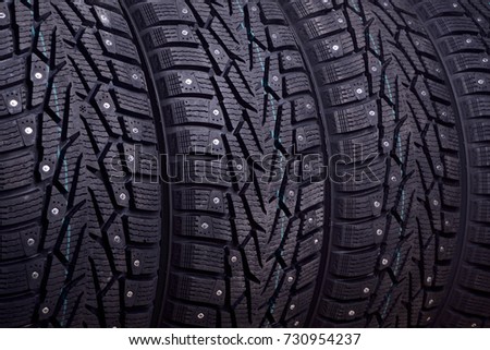 Winter tires with spikes close up