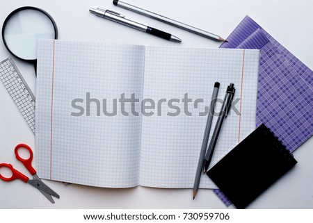 School and office supplies on a white background. View from above
