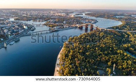 Aerial top view of Kyiv skyline, Dnieper river and Truchaniv island from above, sunset in Kiev city, Ukraine
 Royalty-Free Stock Photo #730964005