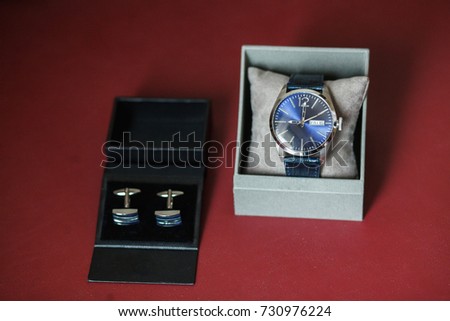 Groom's shoes and cufflinks, a wristwatch on a light background. Wedding concept. Artwork, soft focus