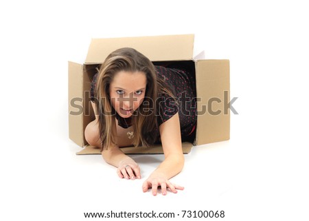 portrait of young woman in the paper box  isolated on the white background