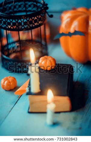background for Halloween: pumpkins, bats, candles wood background