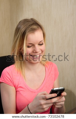 portrait of beautiful teen girl with a cell phone