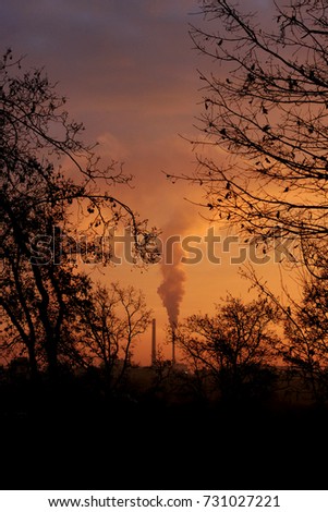 A beautiful shot of sunset over an industrial city 